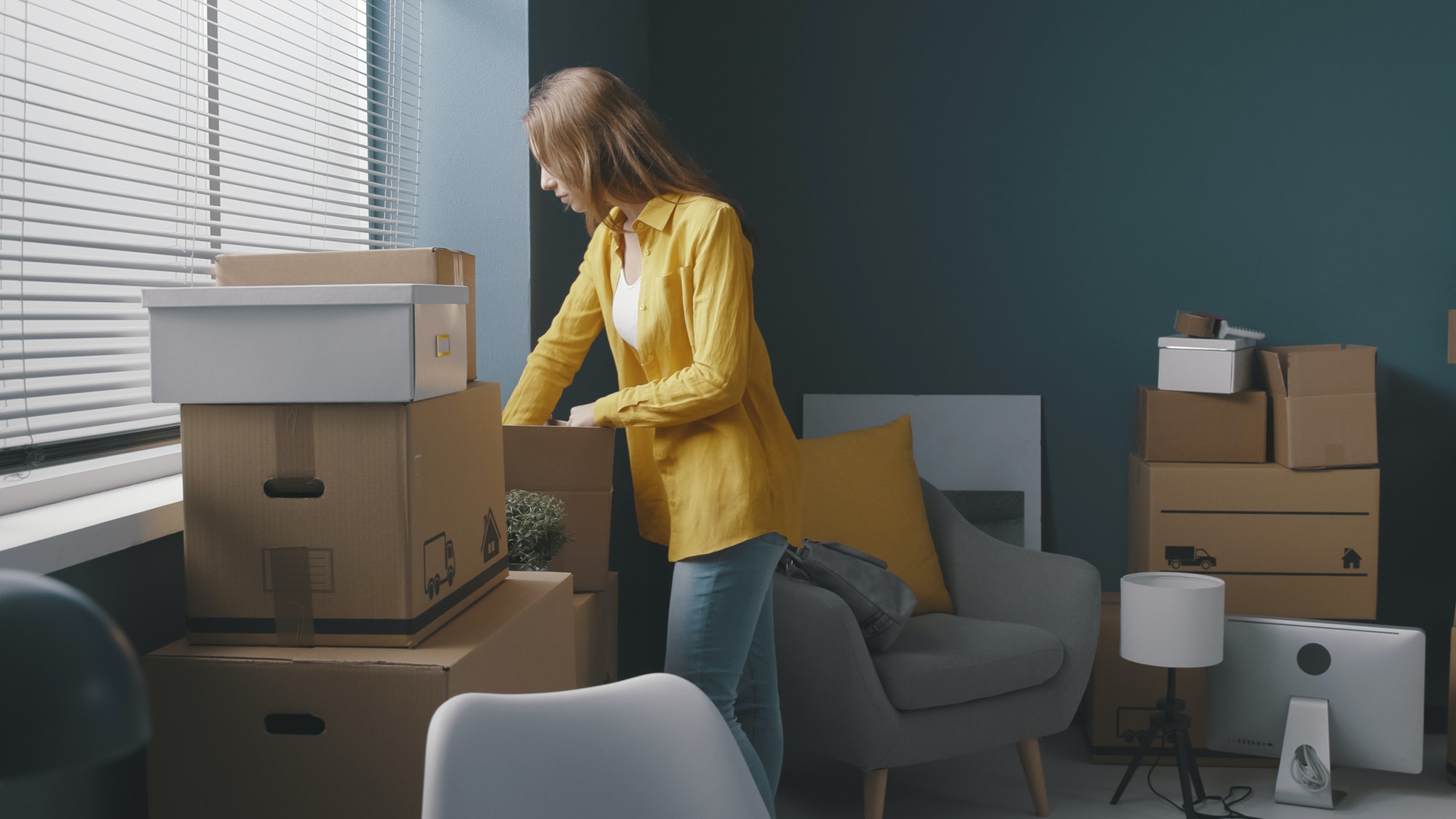 Woman moving in a new house